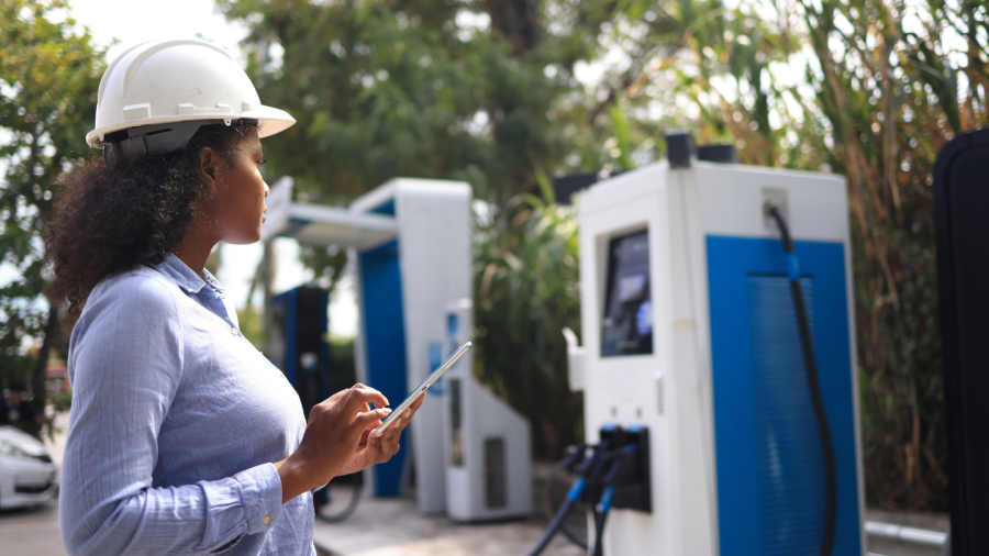 A Woman looking at a car charger