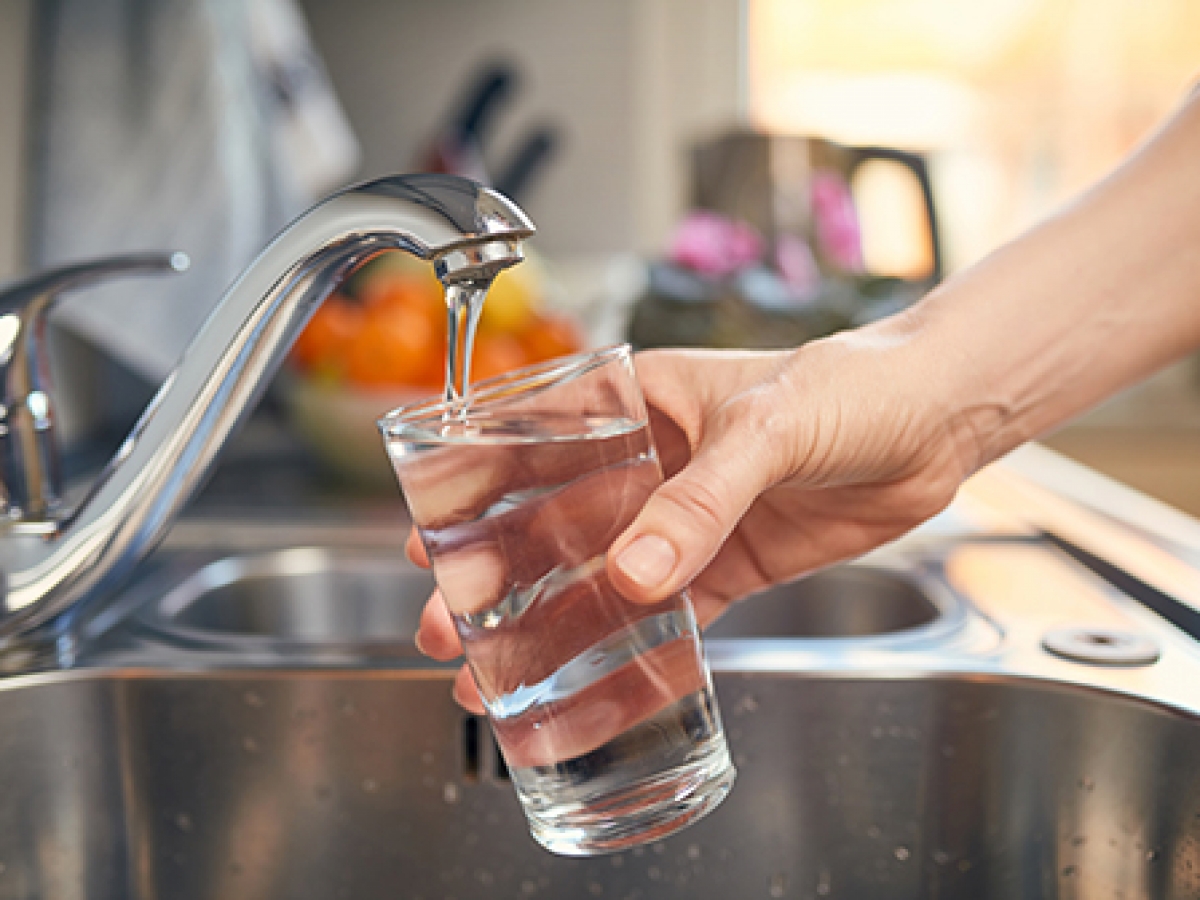 Glass being filled with water